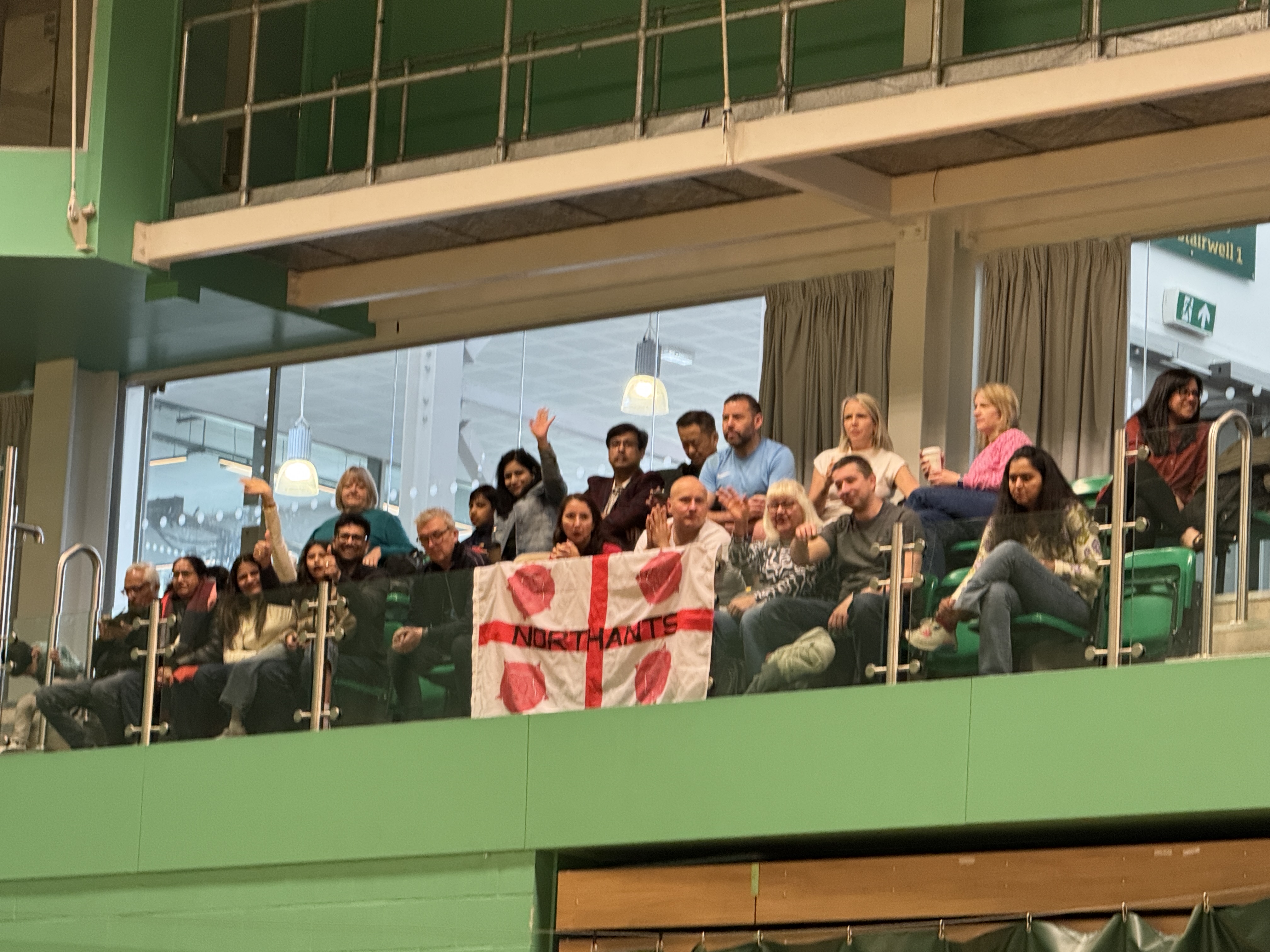 Northants supporters in the stands with their county flag